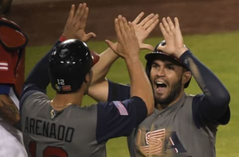 Mar 22, 2017; Los Angeles, CA, USA; United States infielder Eric Hosmer (35) celebrates with teammate United States infielder Nolan Arenado (12) after scoring on Brandon Crawford’s single in the seventh inning against Puerto Rico during the 2017 World Baseball Classic at Dodger Stadium. Mandatory Credit: Robert Hanashiro-USA TODAY Sports