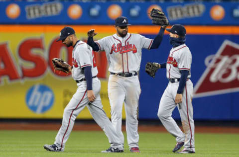 Apr 5, 2017; New York City, NY, USA; Atlanta Braves left fielder Matt Kemp (27) celebrates with Atlanta Braves right fielder Nick Markakis (22) and Atlanta Braves center fielder Ender Inciarte (11) after defeating the New York Mets in twelve innings at Citi Field. Mandatory Credit: Brad Penner-USA TODAY Sports