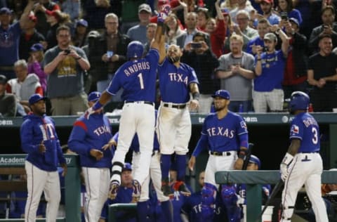 Apr 5, 2017; Arlington, TX, USA; Texas Rangers shortstop Elvis Andrus (1) is congratulated by second baseman Rougned Odor (12) after hitting a home run in the seventh inning against the Cleveland Indians at Globe Life Park in Arlington. Cleveland won 9-6. Mandatory Credit: Tim Heitman-USA TODAY Sports