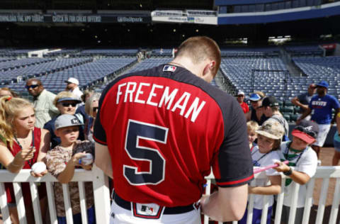 Jul 15, 2016; Atlanta, GA, USA; Atlanta Braves first baseman Freddie Freeman (5) signs autographs for fans before their game against the Colorado Rockies at Turner Field. Mandatory Credit: Jason Getz-USA TODAY Sports