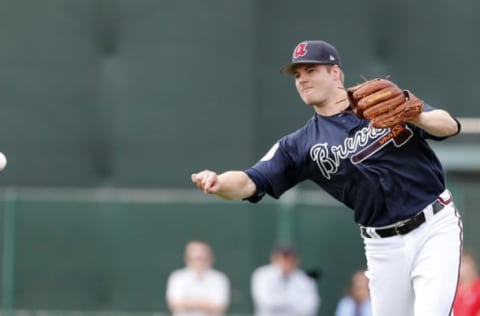 Feb 15, 2017; Lake Buena Vista, FL, USA; Atlanta Braves relief pitcher Jason Hursh (61) throws to third base during MLB spring training workouts at Champion Stadium. Mandatory Credit: Reinhold Matay-USA TODAY Sports