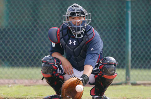 Feb 15, 2017; Lake Buena Vista, FL, USA; Atlanta Braves catcher Kurt Suzuki (24) catches a ball during MLB spring training workouts at Champion Stadium. Mandatory Credit: Reinhold Matay-USA TODAY Sports