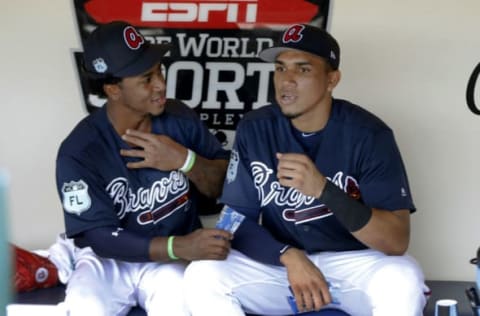 Feb 21, 2017; Disney, FL, USA;Atlanta Braves shortstop Ozzie Albies (left) and shortstop Johan Camargo (right) talk on the bench in a practice following media day for the Atlanta Braves during MLB spring training at Champion Stadium. Mandatory Credit: Reinhold Matay-USA TODAY Sports