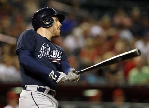 Jun 1, 2015; Phoenix, AZ, USA; Atlanta Braves first baseman Freddie Freeman (5) hits a two-run home run against the Arizona Diamondbacks in the fifth inning at Chase Field. Mandatory Credit: Rick Scuteri-USA TODAY Sports