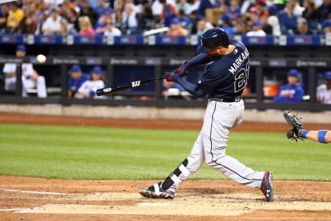 Jun 17, 2016; New York City, NY, USA; Atlanta Braves right fielder Nick Markakis (22) hits an RBI single against the New York Mets during the fifth inning at Citi Field. Mandatory Credit: Brad Penner-USA TODAY Sports