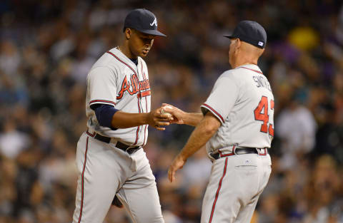 Jul 21, 2016; Denver, CO, USA; Atlanta Braves interim manager Brian Snitker (43) pulls Atlanta Braves relief pitcher Mauricio Cabrera (62) in the eighth inning against the Colorado Rockies at Coors Field. The Rockies defeated the Braves 7-3. Mandatory Credit: Ron Chenoy-USA TODAY Sports