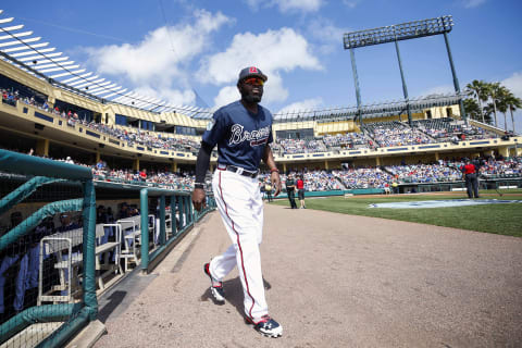 Feb 25, 2017; Lake Buena Vista, FL, USA; Atlanta Braves second baseman Brandon Phillips (4) walks out for warm ups prior to a game against the Toronto Blue Jays at Champion Stadium. Mandatory Credit: Logan Bowles-USA TODAY Sports