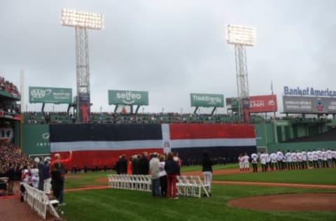 Oct 2, 2016; Boston, MA, USA; A Dominican flag is hung over the left field wall during pregame ceremonies in honor of Boston Red Sox designated hitter Davvid Ortiz (34) prior to a game against the Toronto Blue Jays at Fenway Park. Mandatory Credit: Bob DeChiara-USA TODAY Sports