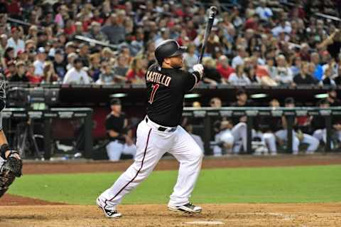 Diamondbacks catcher Welington Castillo (7) hits an RBI double in the seventh inning against the San Diego Padres at Chase Field. Credit: Matt Kartozian-USA TODAY Sports