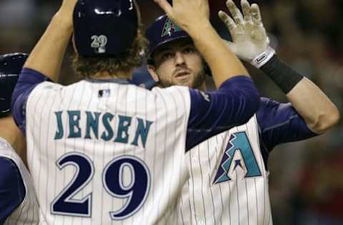 Mitch Haniger (19) celebrates with Kyle Jensen (29) after hitting a three run home run against the Los Angeles Dodgers at Chase Field.  (Rick Scuteri-USA TODAY Sports)