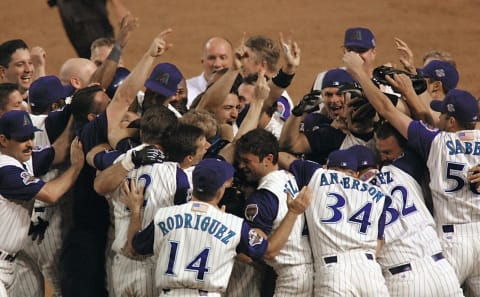 Arizona Diamondbacks celebrate their win of Game 7 of the World Series in Phoenix 04 November 2001. The Diamondbacks rallied with two runs in the ninth inning to defeat the New York Yankees 3-2 and win the 97th World Series four games to three, becoming the fastest expansion club to take the title by doing so in only their fourth season of existence. AFP PHOTO/Mike FIALA (Photo by Mike FIALA / AFP) (Photo credit should read MIKE FIALA/AFP via Getty Images)