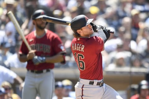 SAN DIEGO, CA – AUGUST 8: Jake Hager #16 of the Arizona Diamondbacks hits a single during the fifth inning of a baseball game against San Diego Padres at Petco Park on August 8, 2021 in San Diego, California. (Photo by Denis Poroy/Getty Images)