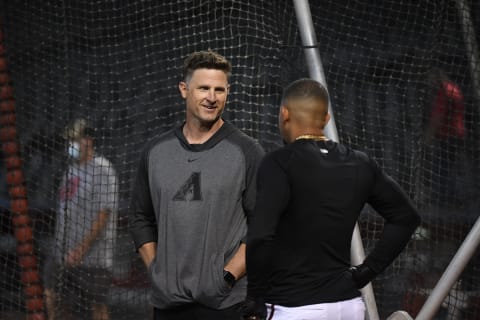 Co-Hitting coach Rick Short #73 of the Arizona Diamondbacks talks with Eduardo Escobar #5 (Photo by Norm Hall/Getty Images)