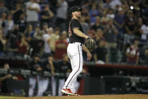 PHOENIX, ARIZONA – AUGUST 14: Starting pitcher Tyler Gilbert #49 of the Arizona Diamondbacks watches a line drive hit by Tommy Pham #28 of the San Diego Padres for the final out of his no-hitter during the ninth inning of the MLB game at Chase Field on August 14, 2021 in Phoenix, Arizona. The Diamondbacks defeated the Padres 7-0. (Photo by Ralph Freso/Getty Images)