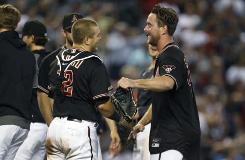 PHOENIX, ARIZONA – AUGUST 14: Starting pitcher Tyler Gilbert #49 of the Arizona Diamondbacks (R) looks to embrace catcher Daulton Varsho #12 of the Diamondbacks following his no-hitter against the San Diego Padres during the MLB game at Chase Field on August 14, 2021, in Phoenix, Arizona. The Diamondbacks defeated the Padres 7-0. (Photo by Ralph Freso/Getty Images)