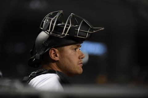 PHOENIX, ARIZONA – AUGUST 31: Carson Kelly #18 of the Arizona Diamondbacks looks on from the dugout during a game against the San Diego Padres at Chase Field on August 31, 2021, in Phoenix, Arizona. (Photo by Norm Hall/Getty Images)