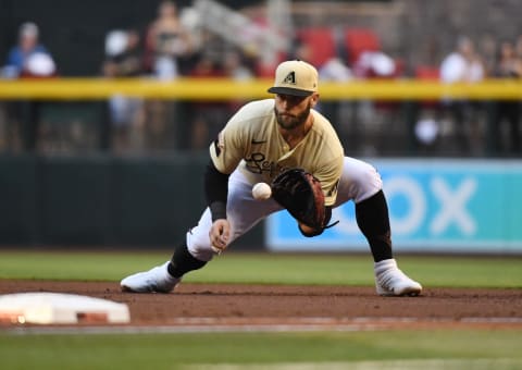 PHOENIX, ARIZONA – SEPTEMBER 25: Christian Walker #53 of the Arizona Diamondbacks makes a play on a ground ball at first base against the Los Angeles Dodgers at Chase Field on September 25, 2021 in Phoenix, Arizona. (Photo by Norm Hall/Getty Images)