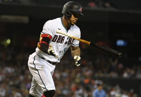 PHOENIX, ARIZONA – OCTOBER 01: Ketel Marte #4 of the Arizona Diamondbacks tosses his bat after hitting a home run against the Colorado Rockies at Chase Field on October 01, 2021, in Phoenix, Arizona. (Photo by Norm Hall/Getty Images)