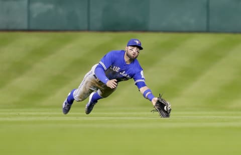 HOUSTON, TX – AUGUST 03: Kevin Pillar #11 of the Toronto Blue Jays makes a diving catch on a line drive by Jose Altuve #27 of the Houston Astros in he fourth inning at Minute Maid Park on August 3, 2016 in Houston, Texas. (Photo by Bob Levey/Getty Images)