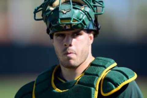 Feb 25, 2015; Mesa, AZ, USA; Oakland Athletics catcher Josh Phegley (19) looks on during a workout at Fitch Park. Mandatory Credit: Joe Camporeale-USA TODAY Sports