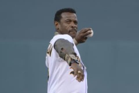 March 31, 2014; Oakland, CA, USA; Oakland Athletics former player Rickey Henderson throws out the ceremonial first pitch before an opening day baseball game against the Cleveland Indians at O.co Coliseum. Mandatory Credit: Kyle Terada-USA TODAY Sports