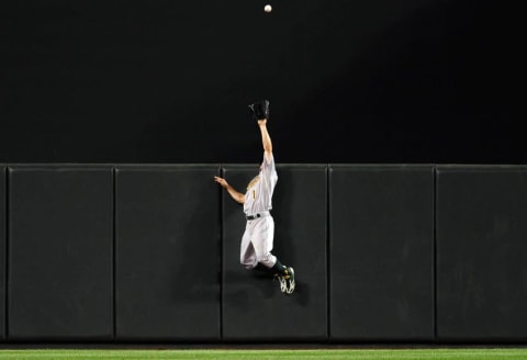 Aug 17, 2015; Baltimore, MD, USA; Oakland Athletics outfielder Billy Burns (1) catches Baltimore Orioles first baseman Chris Davis (not pictured) home run in the seventh inning at Oriole Park at Camden Yards. The Orioles won 4-2. Mandatory Credit: Evan Habeeb-USA TODAY Sports