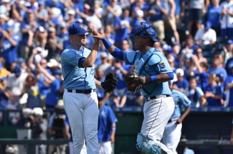 Aug 9, 2015; Kansas City, MO, USA; Kansas City Royals pitcher Ryan Madson (46) celebrates with catcher Salvador Perez (13) after beating the Chicago White Sox 5-4 at Kauffman Stadium. Mandatory Credit: Peter G. Aiken-USA TODAY Sports