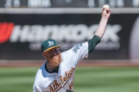 Jun 18, 2014; Oakland, CA, USA; Oakland Athletics relief pitcher Sean Doolittle (62) throws a pitch against the Texas Rangers during the ninth inning at O.co Coliseum. The Oakland Athletics defeated the Texas Rangers 4-2. Mandatory Credit: Ed Szczepanski-USA TODAY Sports