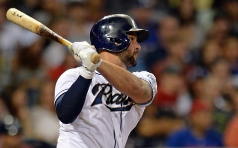 Aug 31, 2015; San Diego, CA, USA; San Diego Padres first baseman Yonder Alonso (23) hits an RBI single during the third inning against the Texas Rangers at Petco Park. Mandatory Credit: Jake Roth-USA TODAY Sports