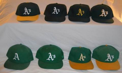 The A’s have had 10 styles of caps since 1968 (Black style excluded in photo)Photo by Richard Paloma