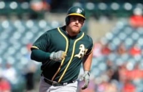 August 4, 2016; Anaheim, CA, USA; Oakland Athletics right fielder Max Muncy (12) rounds the bases after he hits a solo home run in the first inning against Los Angeles Angels at Angel Stadium of Anaheim. Mandatory Credit: Gary A. Vasquez-USA TODAY Sports