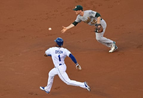 Sep 15, 2016; Kansas City, MO, USA; Oakland Athletics second basemen Joey Wendle (52) tosses the ball to second base to force out Kansas City Royals base runner Jarrod Dyson (1) during the first inning at Kauffman Stadium. Mandatory Credit: Peter G. Aiken-USA TODAY Sports