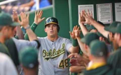 Sep 15, 2016; Kansas City, MO, USA; Oakland Athletics third baseman Ryon Healy (48) celebrates in the dugout after scoring a run against the Kansas City Royals during the second inning at Kauffman Stadium. Mandatory Credit: Peter G. Aiken-USA TODAY Sports