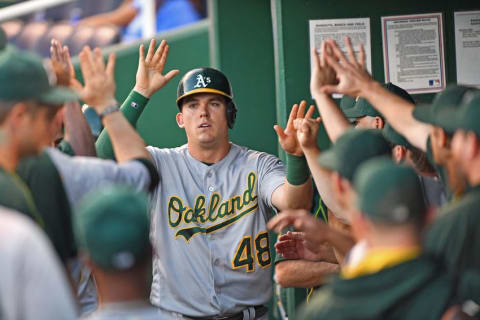 Sep 15, 2016; Kansas City, MO, USA; Oakland Athletics third baseman Ryon Healy (48) celebrates in the dugout after scoring a run against the Kansas City Royals during the second inning at Kauffman Stadium. Mandatory Credit: Peter G. Aiken-USA TODAY Sports