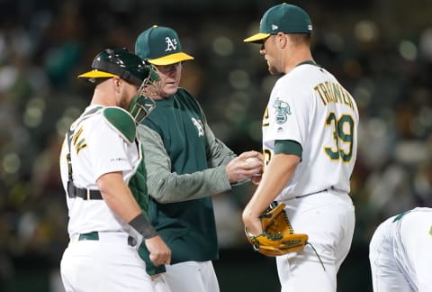 OAKLAND, CA – JULY 03: Manager Bob Melvin #6 of the Oakland Athletics take the ball from Blake Treinen #39 taking Treinen out of the game against the Minnesota Twins in the top of the 12th inning of a Major League Baseball game at Oakland-Alameda County Coliseum on July 3, 2019 in Oakland, California. (Photo by Thearon W. Henderson/Getty Images)