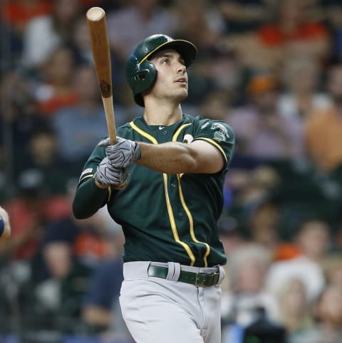 HOUSTON, TEXAS – JULY 23: Matt Olson #28 of the Oakland Athletics hits a three-run home run in the ninth inning against the Houston Astros at Minute Maid Park on July 23, 2019 in Houston, Texas. (Photo by Bob Levey/Getty Images)