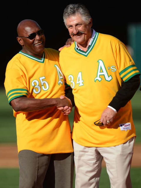 OAKLAND, CA – APRIL 21: Vida Blue #35 and Rollie Fingers #34, two teammates of the 1972 World Champions Oakland Athletics, laugh it up before the game between the Cleveland Indians and the Oakland Athletics at O.co Coliseum on April 21, 2012 in Oakland, California. The Oakland Athletics honored the 1972 Championship team for a forty-year reunion. (Photo by Thearon W. Henderson/Getty Images)