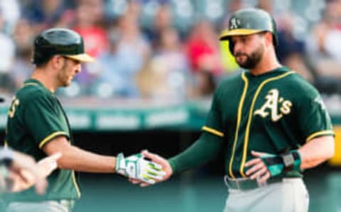 A’s first baseman Yonder Alonso (on right)