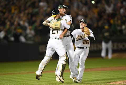 OAKLAND, CA – APRIL 21: Sean Manaea #55, Jonathan Lucroy #21 and Matt Chapman #26 of the Oakland Athletics celebrate after Manaea pitched a no-hitter against the Boston Red Sox at the Oakland Alameda Coliseum on April 21, 2018, in Oakland, California. The Athletics won the game 3-0. (Photo by Thearon W. Henderson/Getty Images)