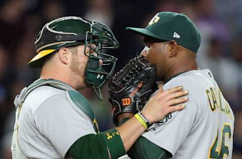 May 26, 2017; Bronx, NY, USA; Oakland Athletics catcher Stephen Vogt (21) talks to Oakland Athletics relief pitcher Santiago Casilla (46) during the ninth inning against the New York Yankees at Yankee Stadium. Mandatory Credit: Brad Penner-USA TODAY Sports