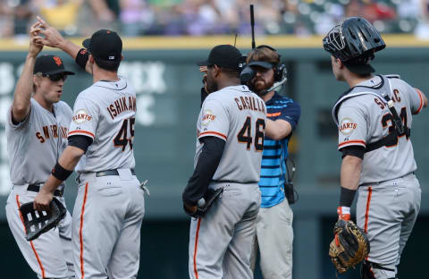 Sep 1, 2014; Denver, CO, USA; San Francisco Giants right fielder Hunter Pence (8) celebrates with first baseman Travis Ishikawa (45), relief pitcher Santiago Casilla (46), and catcher Andrew Susac (34) after defeating the Colorado Rockies at Coors Field. Mandatory Credit: Ron Chenoy-USA TODAY Sports