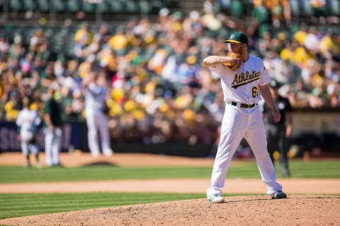 Apr 16, 2016; Oakland, CA, USA; Oakland Athletics relief pitcher Sean Doolittle (62) prepares to pitch against the Kansas City Royals in the eight inning at the Coliseum. The Oakland Athletics defeated the Kansas City Royals 5 to 3. Mandatory Credit: Neville E. Guard-USA TODAY Sports