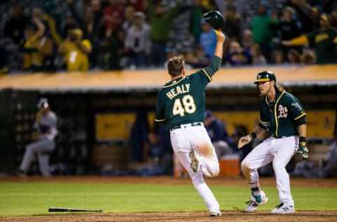 Jul 22, 2016; Oakland, CA, USA; Oakland Athletics third baseman Ryon Healy (48) celebrates after a walk-off win on hit by Oakland Athletics left fielder Coco Crisp (not shown) against the Tampa Bay Rays in the thirteen inning at O.co Coliseum. Oakland won 1-0. Mandatory Credit: John Hefti-USA TODAY Sports