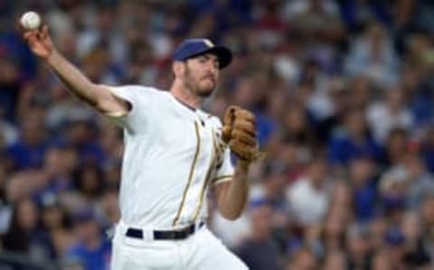 Aug 22, 2016; San Diego, CA, USA; San Diego Padres third baseman Adam Rosales (9) throws to first during the second inning against the Chicago Cubs at Petco Park. Mandatory Credit: Jake Roth-USA TODAY Sports