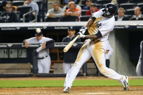 May 22, 2015; Bronx, NY, USA; New York Yankees shortstop Didi Gregorius (18) hits a home run to right bringing in two runners to score during the fourth inning against the Texas Rangers at Yankee Stadium. Mandatory Credit: Anthony Gruppuso-USA TODAY Sports