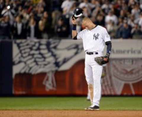 Sep 25, 2014; Bronx, NY, USA; New York Yankees shortstop Derek Jeter (2) tips his hat in the ninth inning of the game against the Baltimore Orioles at Yankee Stadium. Mandatory Credit: Robert Deutsch-USA TODAY Sports