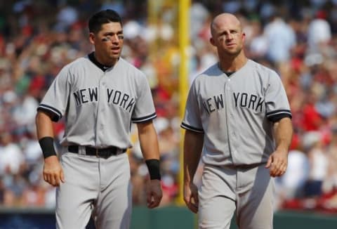 Jul 12, 2015; Boston, MA, USA; New York Yankees center fielder Jacoby Ellsbury (22) and left fielder Brett Gardner (11) talk between innings against the Boston Red Sox at Fenway Park. Mandatory Credit: Winslow Townson-USA TODAY Sports