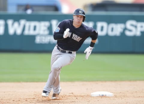 Mar 30, 2016; Lake Buena Vista, FL, USA; New York Yankees center fielder Dustin Fowler (95) rounds second base for a triple during the eighth inning of a spring training baseball game against the Atlanta Braves at Champion Stadium. Mandatory Credit: Reinhold Matay-USA TODAY Sports