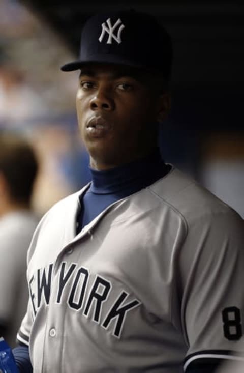 May 28, 2016; St. Petersburg, FL, USA; New York Yankees relief pitcher Aroldis Chapman (54) looks on in the dugout during the fifth inning against the Tampa Bay Rays at Tropicana Field. Mandatory Credit: Kim Klement-USA TODAY Sports