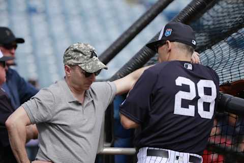 Mar 2, 2016; Tampa, FL, USA; New York Yankees general manager Brian Cashman talks with manager Joe Girardi (28) prior to the game at George M. Steinbrenner Field. Mandatory Credit: Kim Klement-USA TODAY Sports